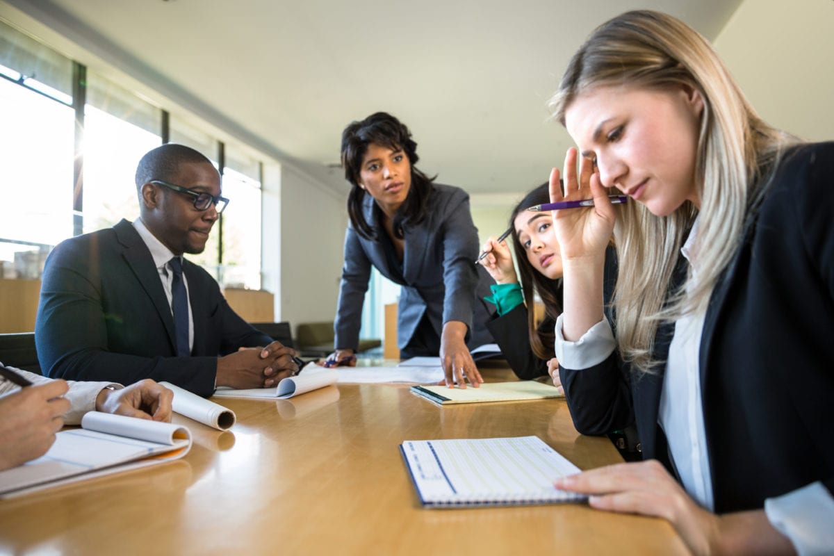 Stressed overworked worker at business meeting 